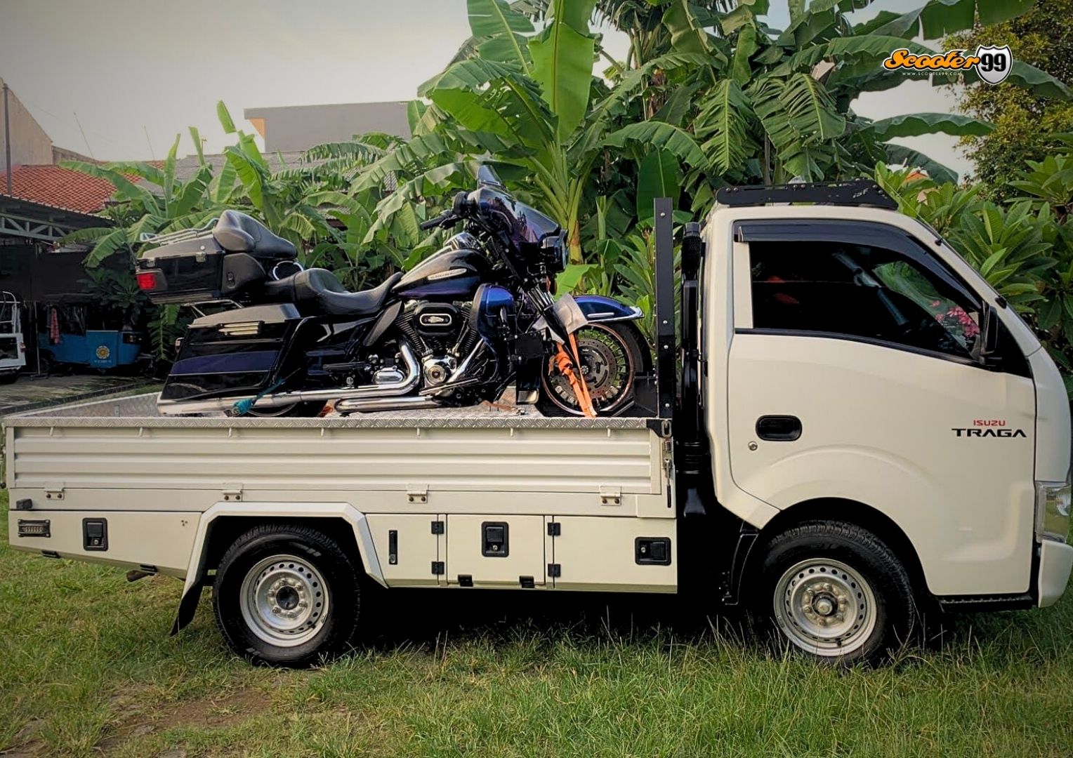 Towing truck in action, securing a vehicle on the roadside
